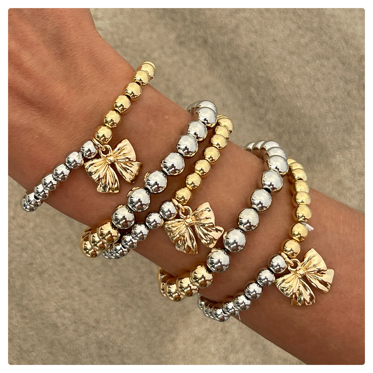 Pulsera con borlas en forma de lazo estilo Ins con diseño de capas en bloques de color para mujer en aleación con acabado galvanizado