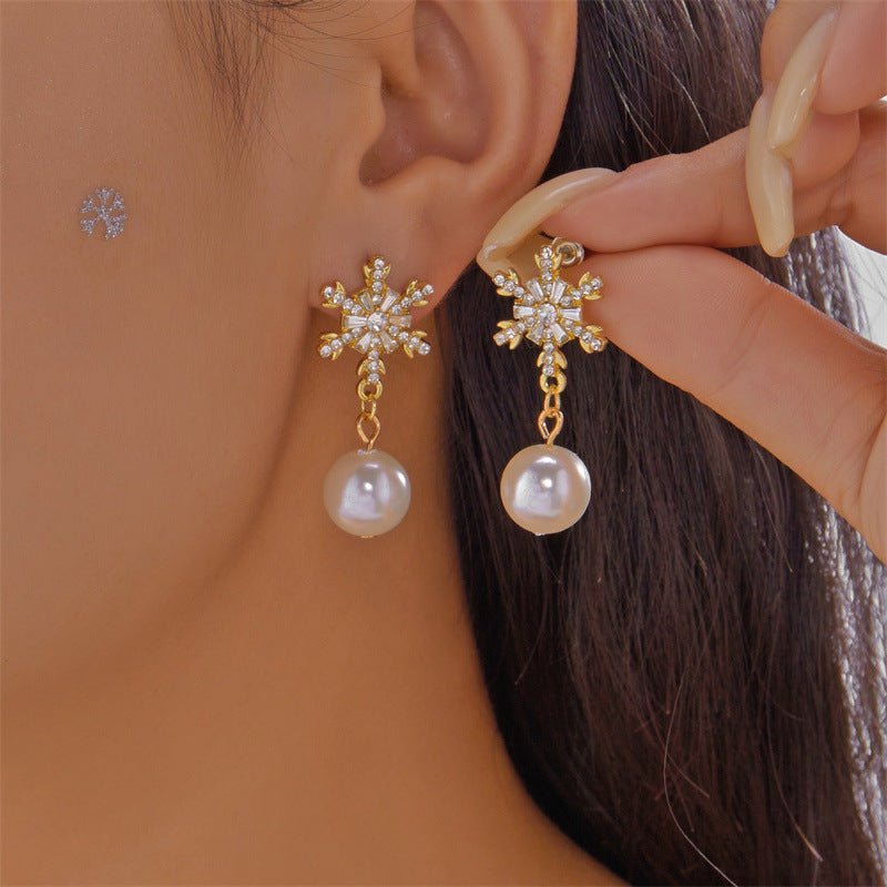 Eleganti orecchini pendenti a fiocco di neve in lega con zirconi intarsiati da donna