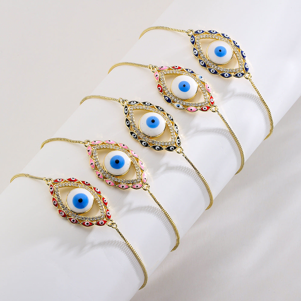 Bracciale da donna stile bohémien con charm a forma di occhio di Nazar, base in rame placcata in vero oro e intarsio di zirconi