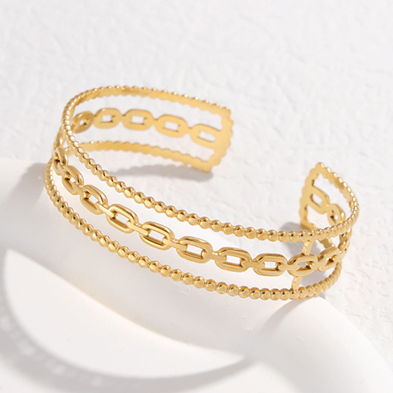 Bracciale da donna in acciaio al titanio con design geometrico minimalista, a forma di C, finitura placcata e dettaglio catena