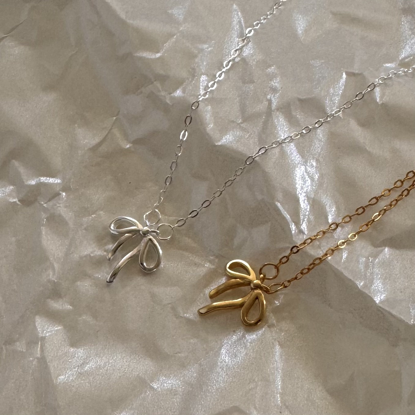 Minimalist Bow Knot Pendant Necklace in 925 Sterling Silver with Plated Finish on Cross Chain