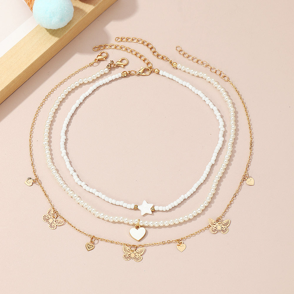 Set di collane con ciondoli a forma di cuore, farfalla e stella, da bambina, con ciondolo in lega e catena di perle in stile principessa