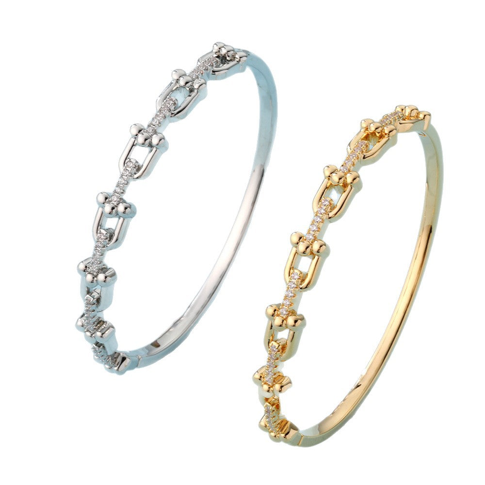 Bracciale a cerchio con fibbia a ferro di cavallo a U geometrica alla moda OL in rame placcato oro 18 carati con zirconi 3A da donna