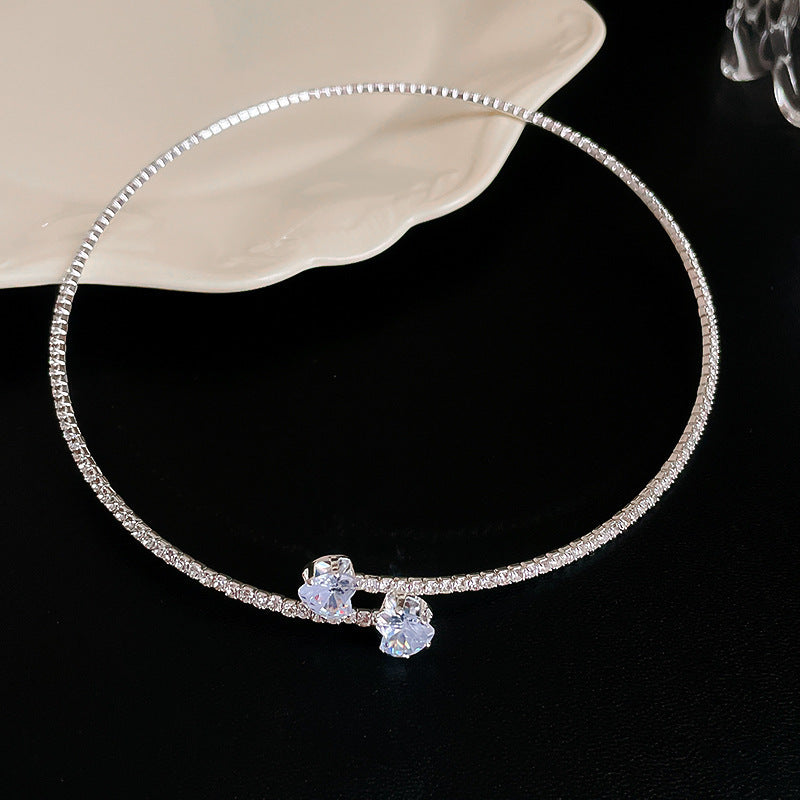 Collana con pendente a cuore a goccia in stile lusso con intarsio in strass in acciaio al titanio su catena in rame da donna