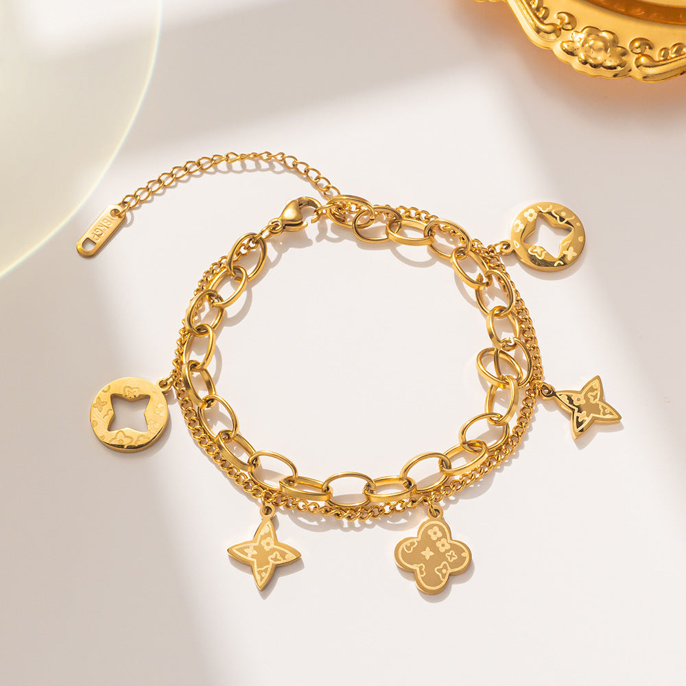 Elegante Pulsera Minimalista de Acero de Titanio con Colgante Redondo Bañado en Oro de 18K y Dije de Hoja para Mujer