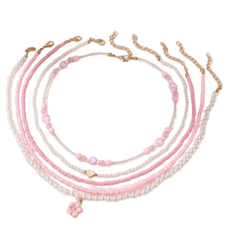 Collar Minimalista de Corazón de Concha Marina y Perla para Niñas con Dije de Resina y Acabado Pulido en Cadena de Cuentas