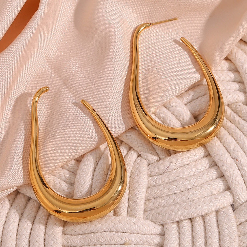 Pendientes de aro curvos huecos de acero inoxidable geométricos minimalistas chapados en oro de 18 quilates para mujer
