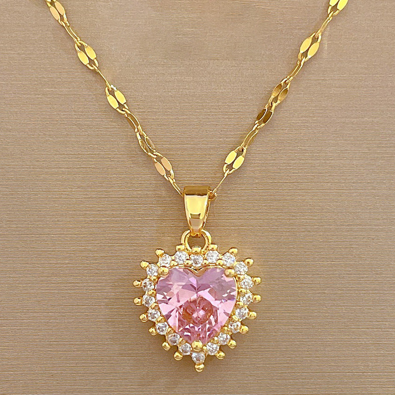 Parure di collana e orecchini a cuore geometrici in acciaio al titanio di lusso