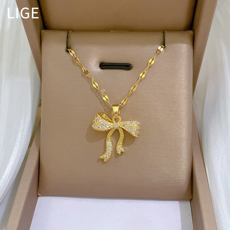 Collana con pendente di lusso con fiocco in strass per donna, girocollo delicato in acciaio inossidabile con lunghezza della catena regolabile