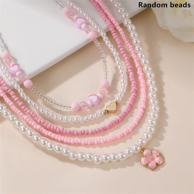 Collar Minimalista de Corazón de Concha Marina y Perla para Niñas con Dije de Resina y Acabado Pulido en Cadena de Cuentas