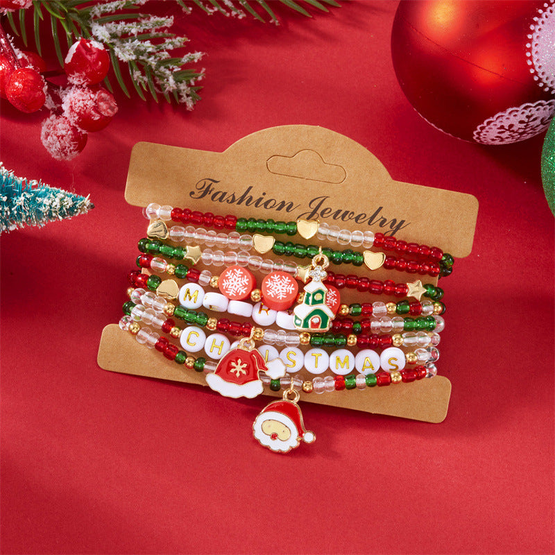 Pulsera minimalista con temática navideña con diseño de Papá Noel, bastón, muñeco de nieve, cuentas con letras y dije de aleación