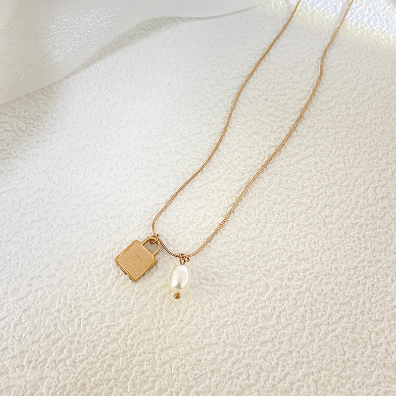 Minimalist Geometric Stainless Steel Pendant Necklace for Women with Snake Chain and Lucky Lock Design
