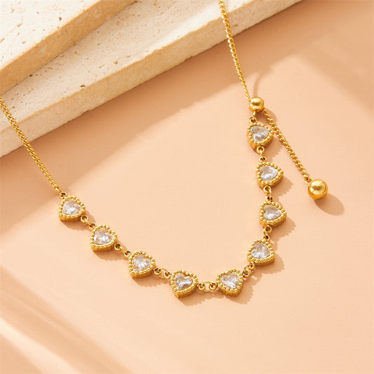 Collana minimalist in acciaio inossidabile placcato con ciondolo a cuore, strass e catena lunga a nappa