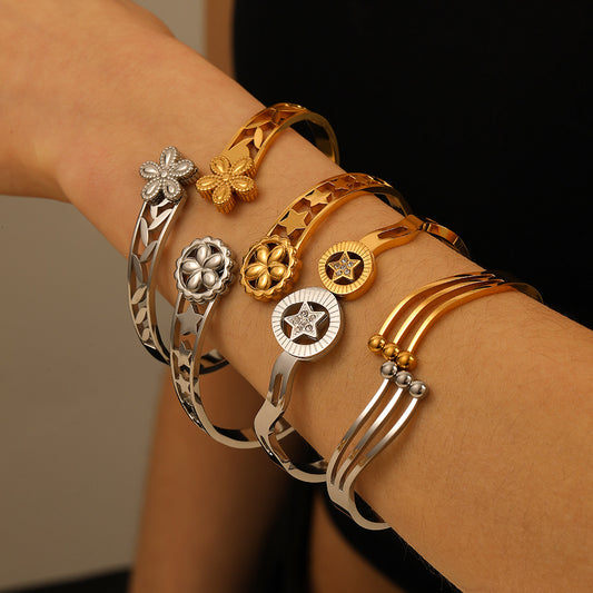 Bracciale Minimalista Asimmetrico in Acciaio Inossidabile Placcato Oro con Motivi Floreali, Stellari e Design Lineare