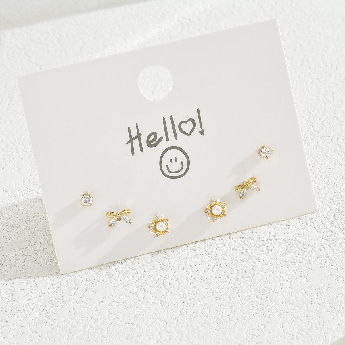 Pendientes de cobre minimalistas con forma de lazo y circonitas, con postes de acero inoxidable para mujer