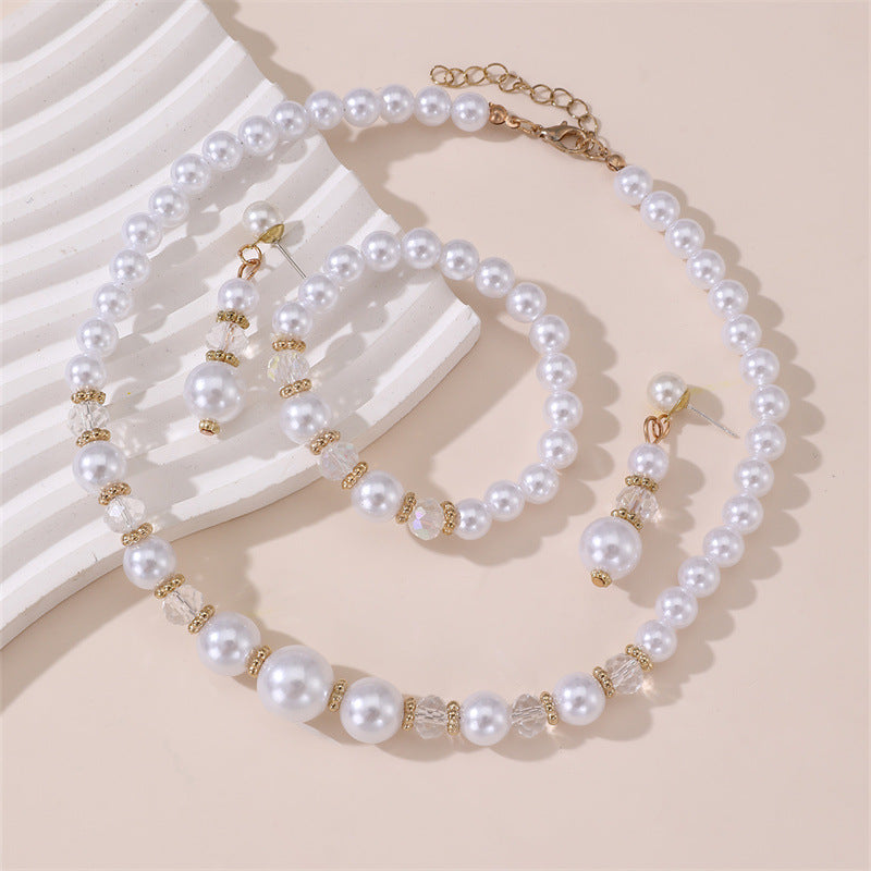 Conjunto de collar, aretes y pulsera minimalistas con perlas y lazo para niñas