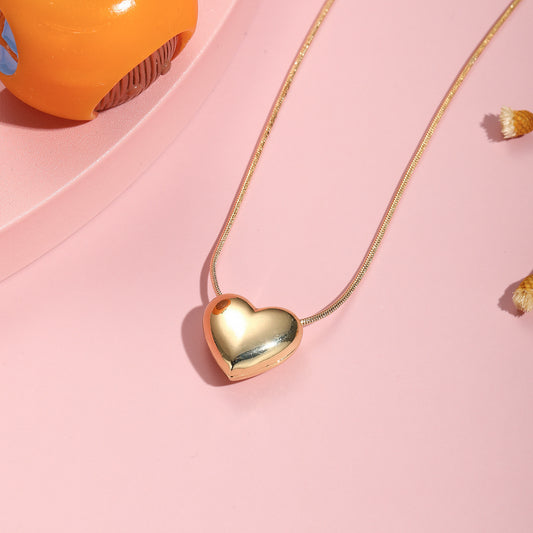 Collar de cobre con forma de corazón a la moda con cadena de serpiente chapada en oro para mujeres y niños