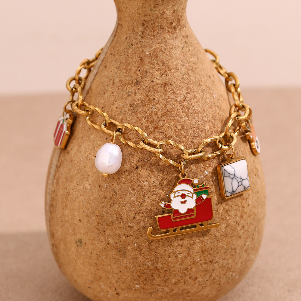 Simpatico bracciale da donna in acciaio inossidabile placcato oro 18 carati con Babbo Natale e renne in stile cartone animato