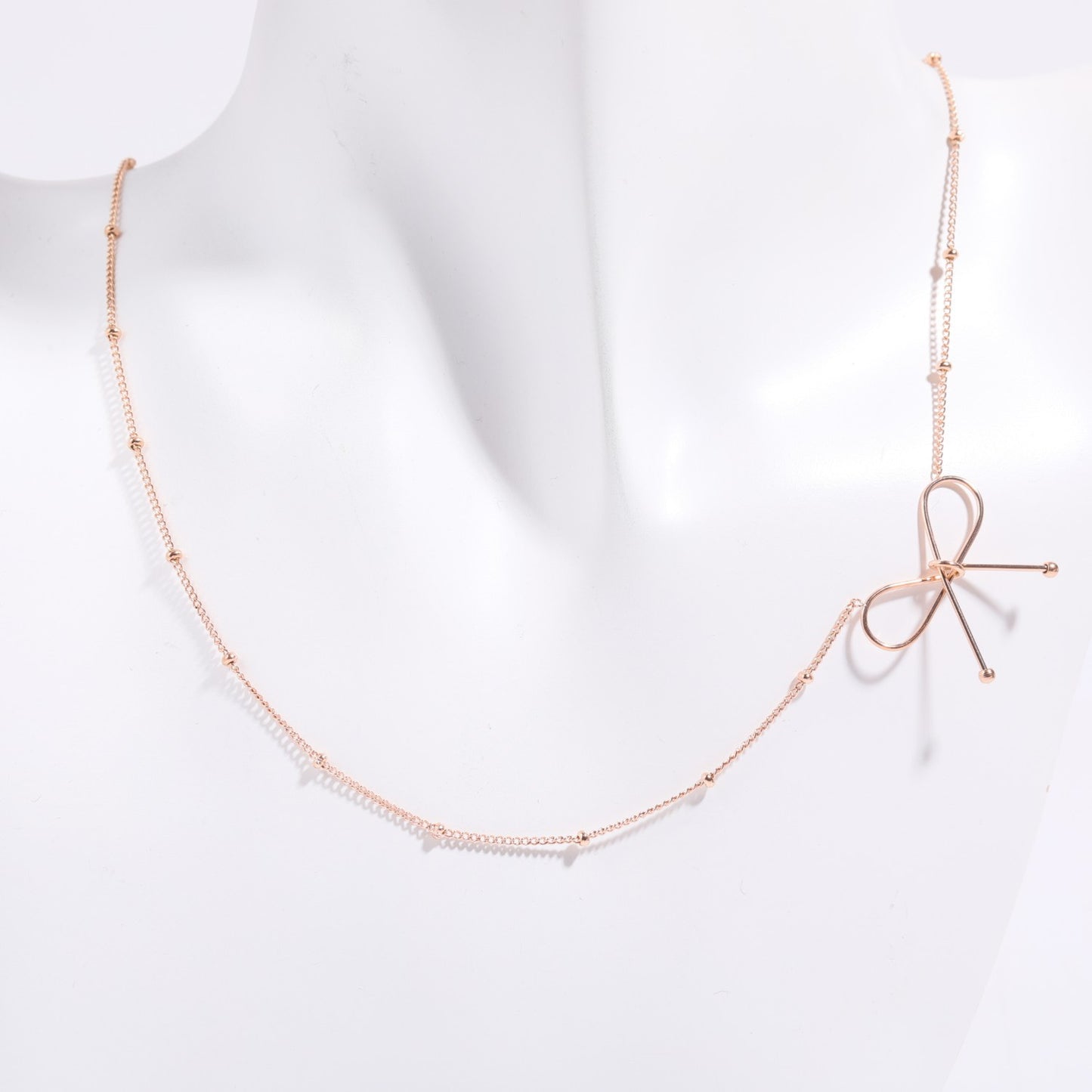 Parure Collana e Bracciale da Donna con Fiocco in Acciaio al Titanio Placcato Oro 18K