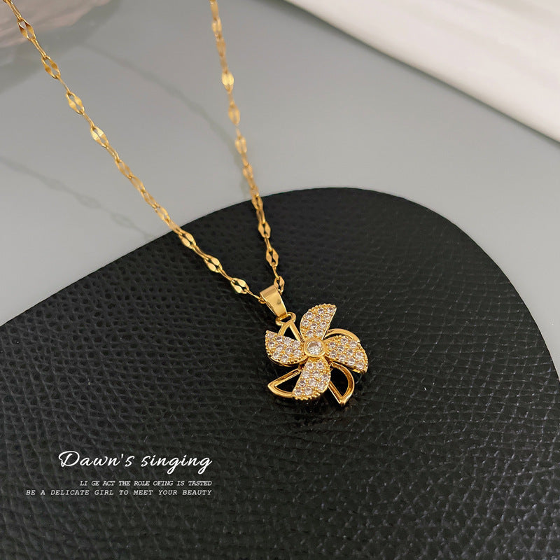 Collana con ciondolo a mulino a vento girevole da donna con design cavo e strass completi in acciaio al titanio, catena a medaglione in stile geometrico minimalista