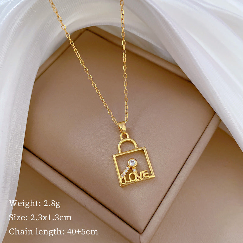 Minimalist Geometric LOVE Key Lock Pendant Necklace for Women and Men in Titanium Steel with Rhinestone Accents on Snake Chain