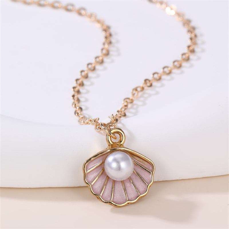 Dulce Collar con Colgante de Mariposa y Lazo Fresco para Niñas con Dije de Concha con Perlas de Aleación y Acabado Esmaltado Artesanal