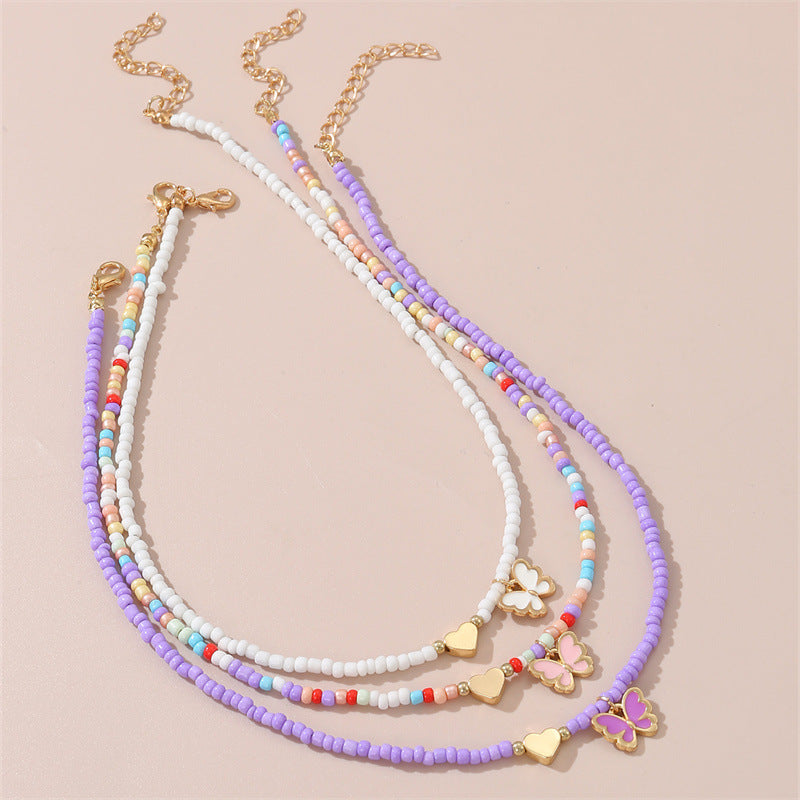 Collar artesanal bohemio con cuentas de cristal blancas en forma de corazón para niños