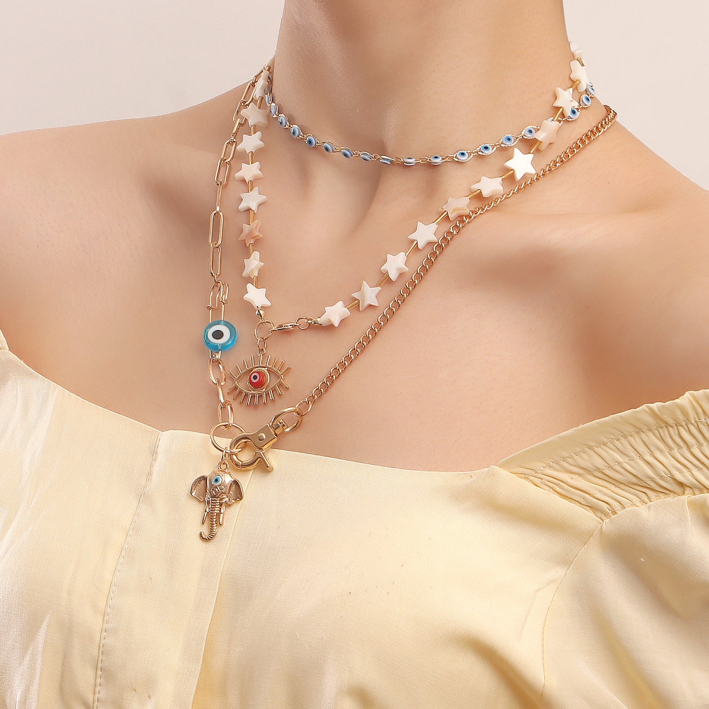 Bohemian Star-Shaped Alloy Pendant Necklace with Evil Eye Charm and Elephant Nose Detail for Women