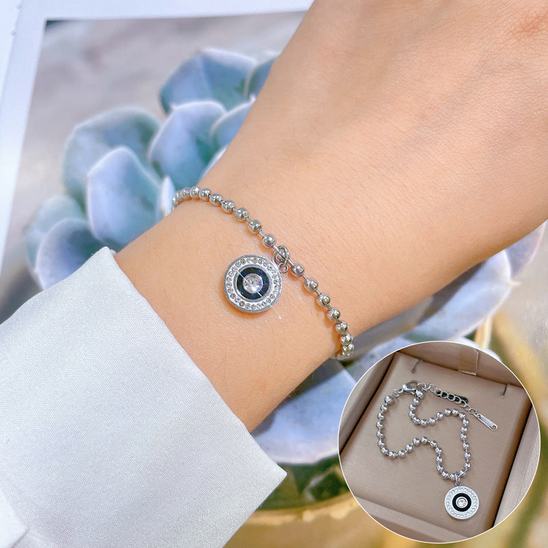 Bracciale ad anello in stile vintage romano da donna in acciaio al titanio con intarsio di strass e trama ondulata