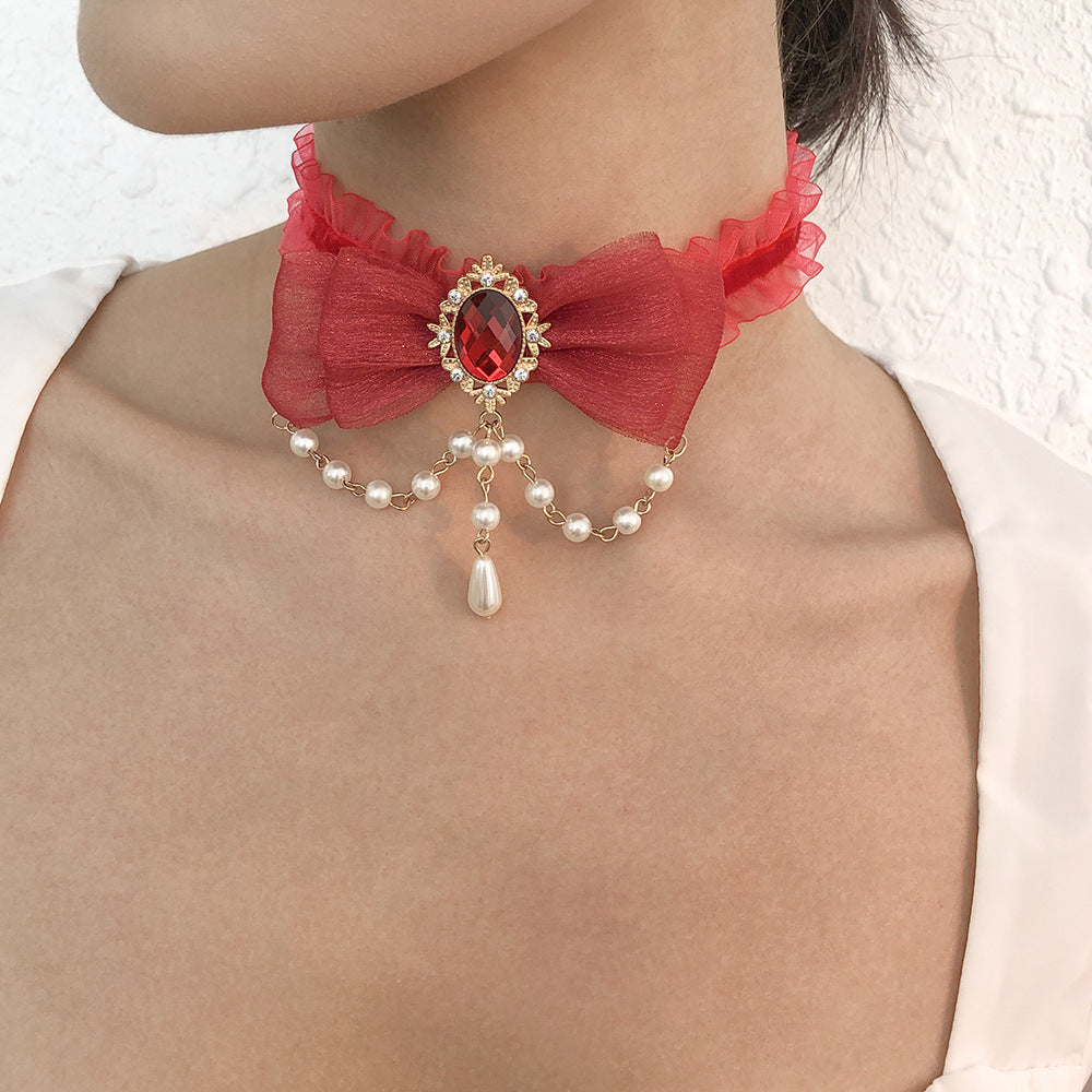 Collar de nudo de lazo geométrico dulce y atrevido con base de aleación, colgante de imitación de perla y detalles de estrella-luna para mujer