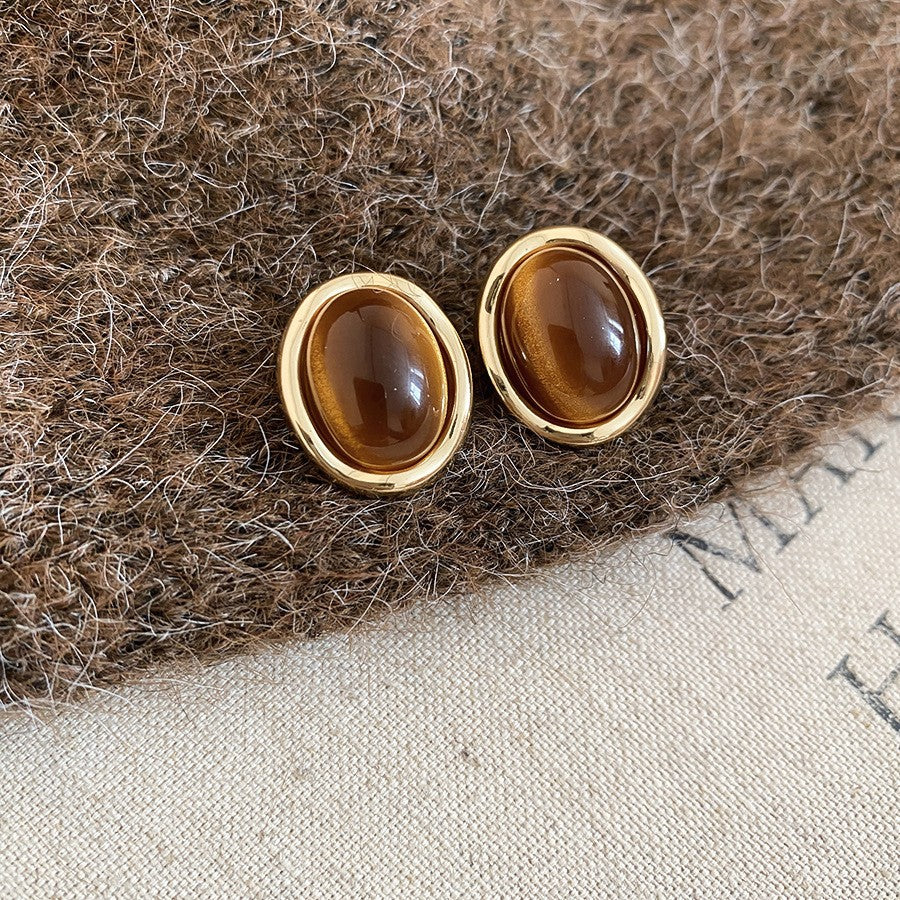 Pendientes de botón de acero chapado de estilo lujoso con perlas de imitación y detalles de ojo de tigre con diseño floral para mujer