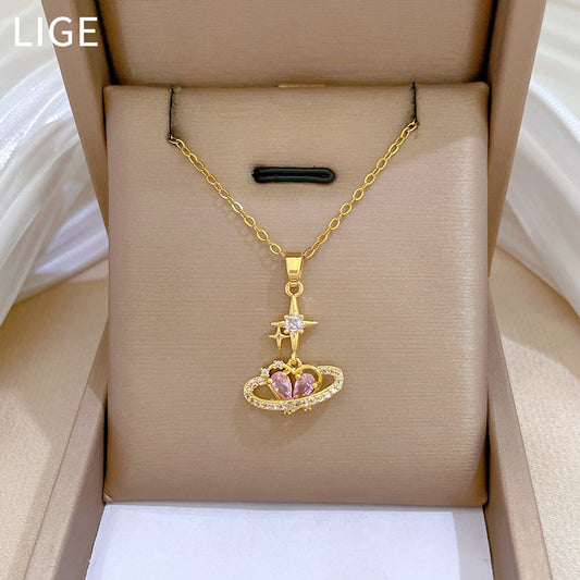 Collar con colgante minimalista de corazón con efecto estrella para mujer en acero de titanio con incrustaciones de diamantes de imitación en delicada cadena de clavícula