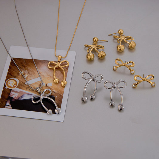 Conjunto de pendientes y collar de acero inoxidable con forma de lazo estilo princesa, con colgante de acero de titanio y acabado galvanizado para mujer