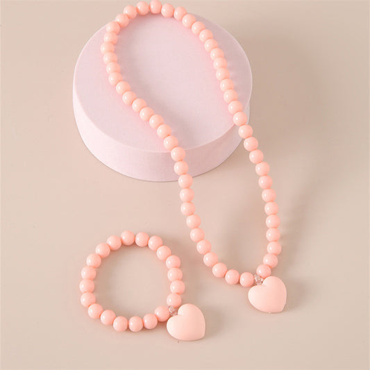 Lindo conjunto de collar y pulsera con dije de corazón de acrílico hecho a mano para niños en estilo minimalista