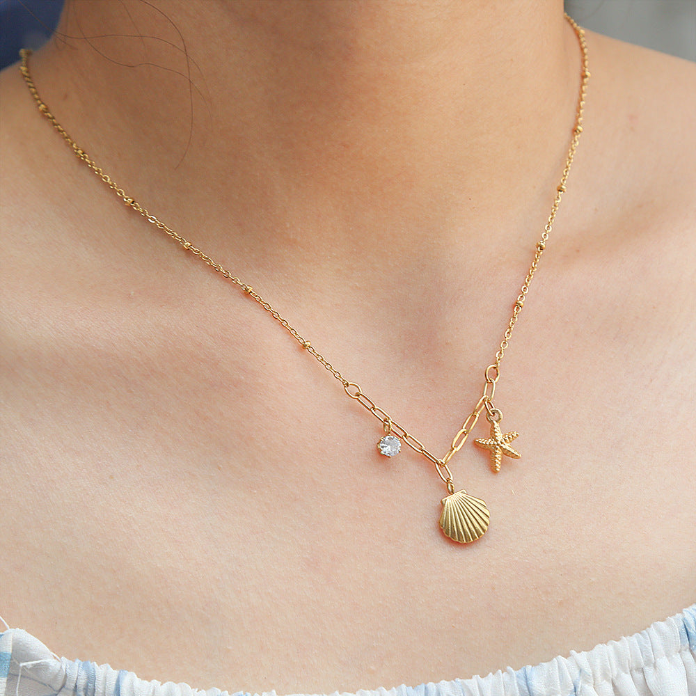 Collar con colgante de concha y estrella minimalista inspirado en el océano en acero inoxidable con baño de oro de 18 quilates en cadena O