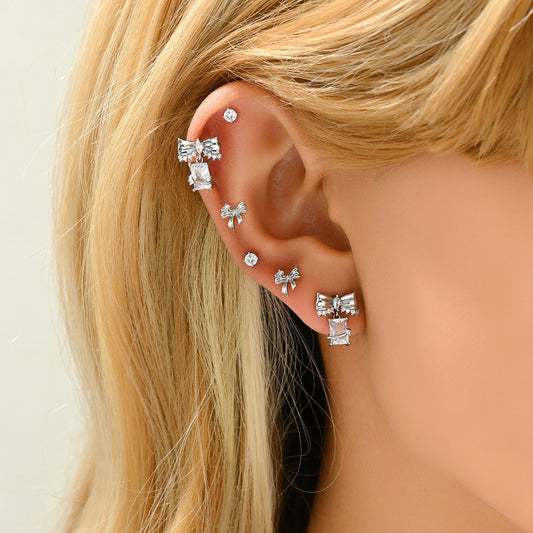 Orecchini artistici vintage a forma di fiocco da donna con intarsi in zircone su base in rame e perni in acciaio inossidabile