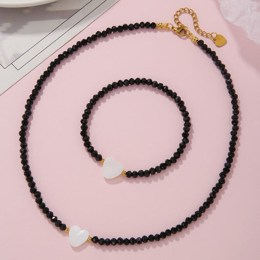 Collana da donna stile bohémien con cuore in conchiglia e perline di vetro con catena a maglie O in acciaio inossidabile
