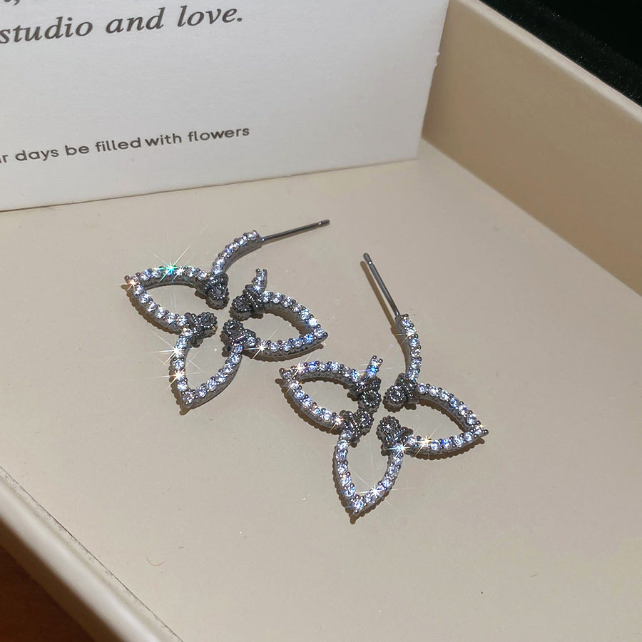 Pendientes florales minimalistas con incrustaciones de circonita en postes de acero inoxidable para mujer