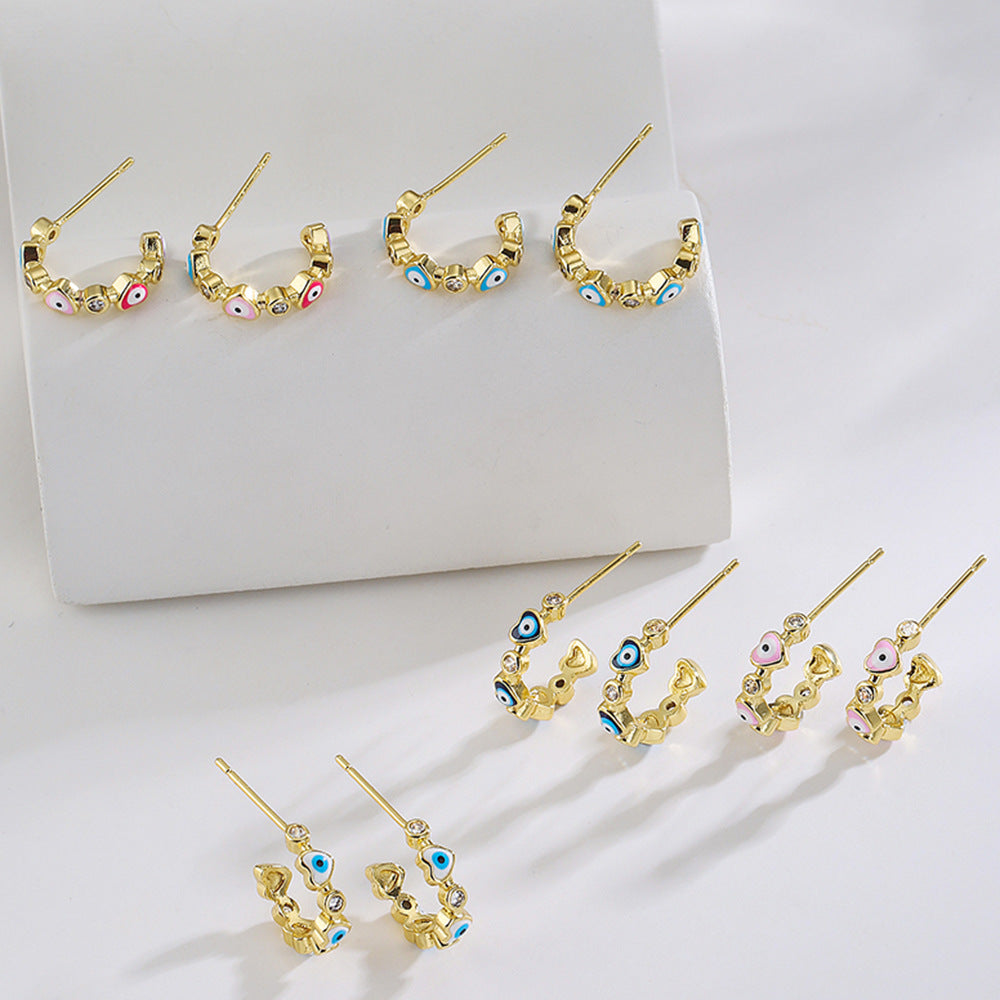 Geometric Style Copper Earrings with 18K Gold Plating and Micro-Paved Zirconia Heart-Eye C-Shaped Design for Women