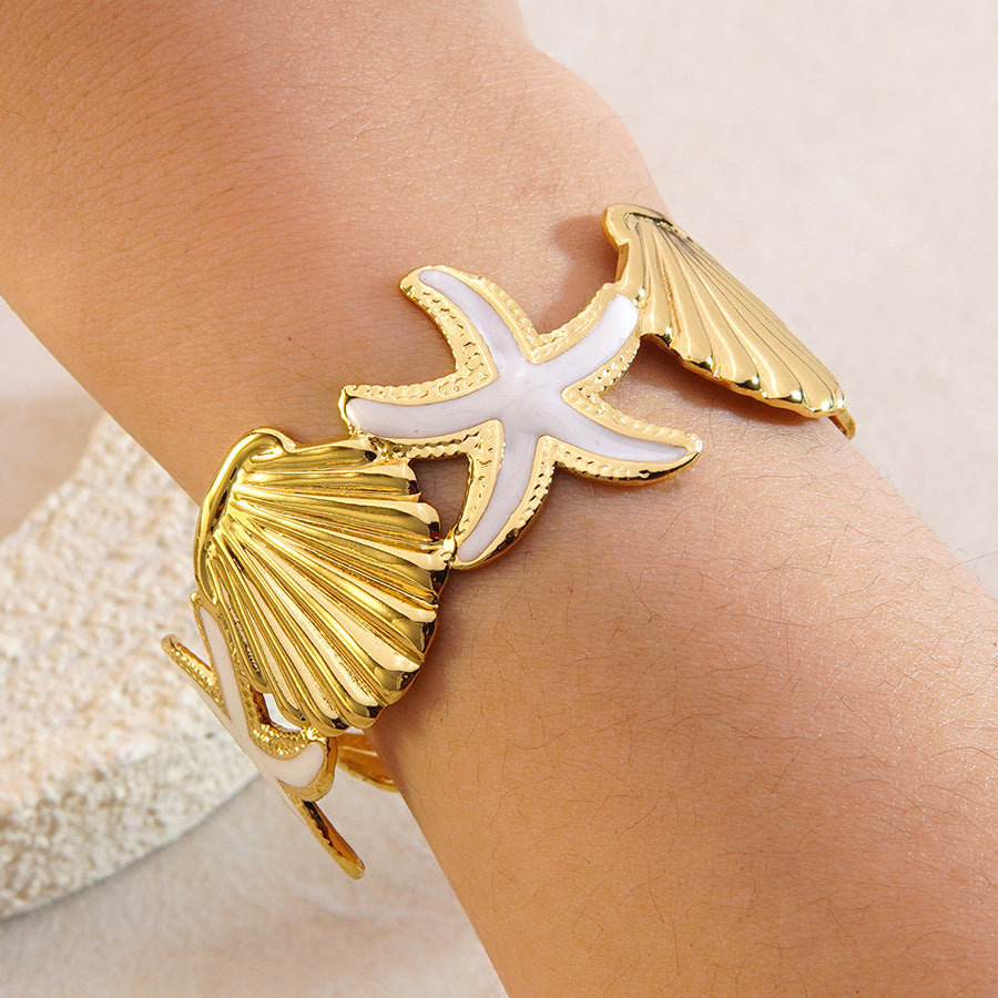 Bracciale a polsino in acciaio inossidabile con gocciolamento casuale, stella marina e conchiglia