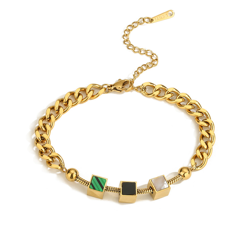 Bracciale da donna in acciaio al titanio con geometria minimalista, finitura placcata e design a catena ispirato alle conchiglie