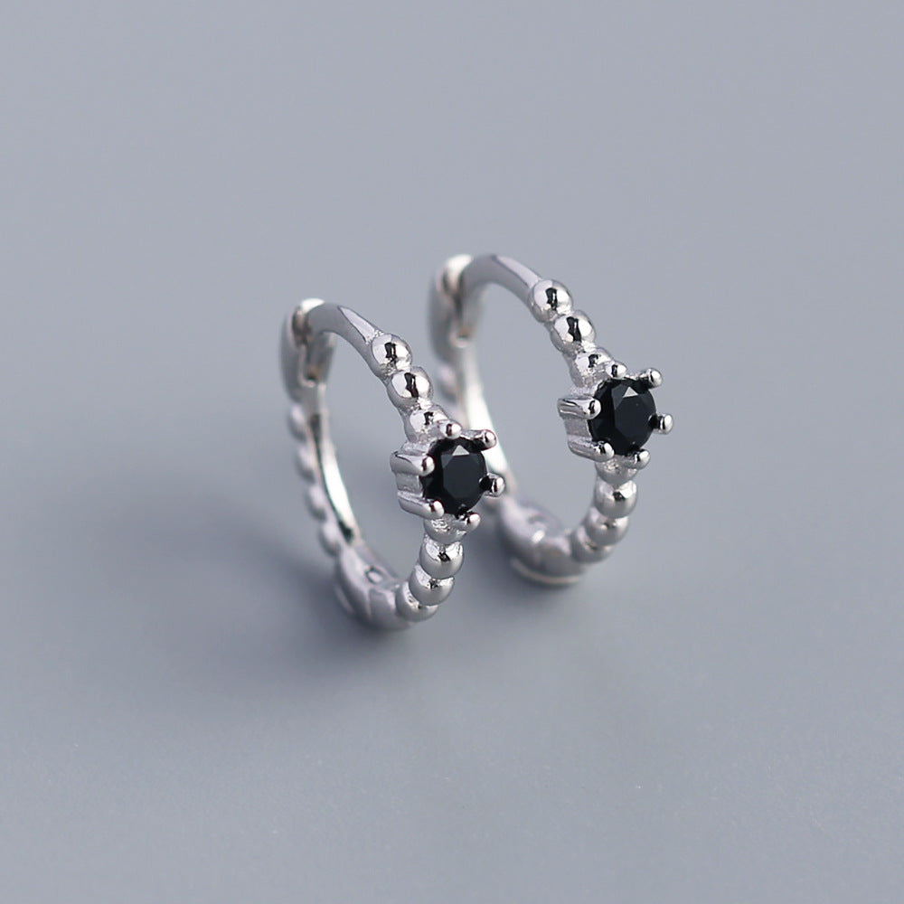 Orecchini a perno tondi con intarsi di diamanti in argento sterling 925