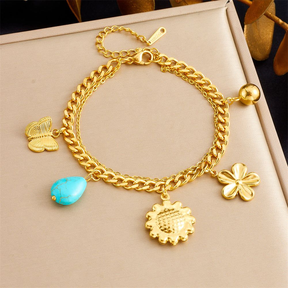 Bracciale con ciondolo floreale e a cuore in stile vintage in acciaio inossidabile con finitura placcata da donna