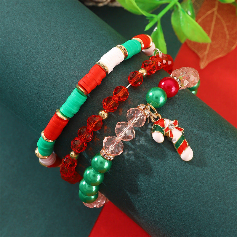 Set di bracciali natalizi fatti a mano in argilla polimerica da donna con ciondoli di Babbo Natale e fiocchi di neve in stile cartone animato giocoso