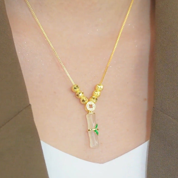 Collar minimalista de acero de titanio con forma de nudo de bambú para mujer con baño de oro y colgante floral irregular