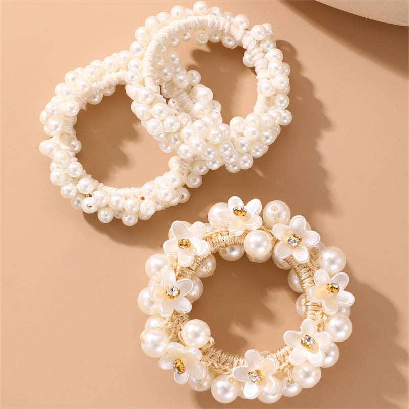 Juego de gomas de pelo florales minimalistas para niños con detalles de perlas y estructura de resina