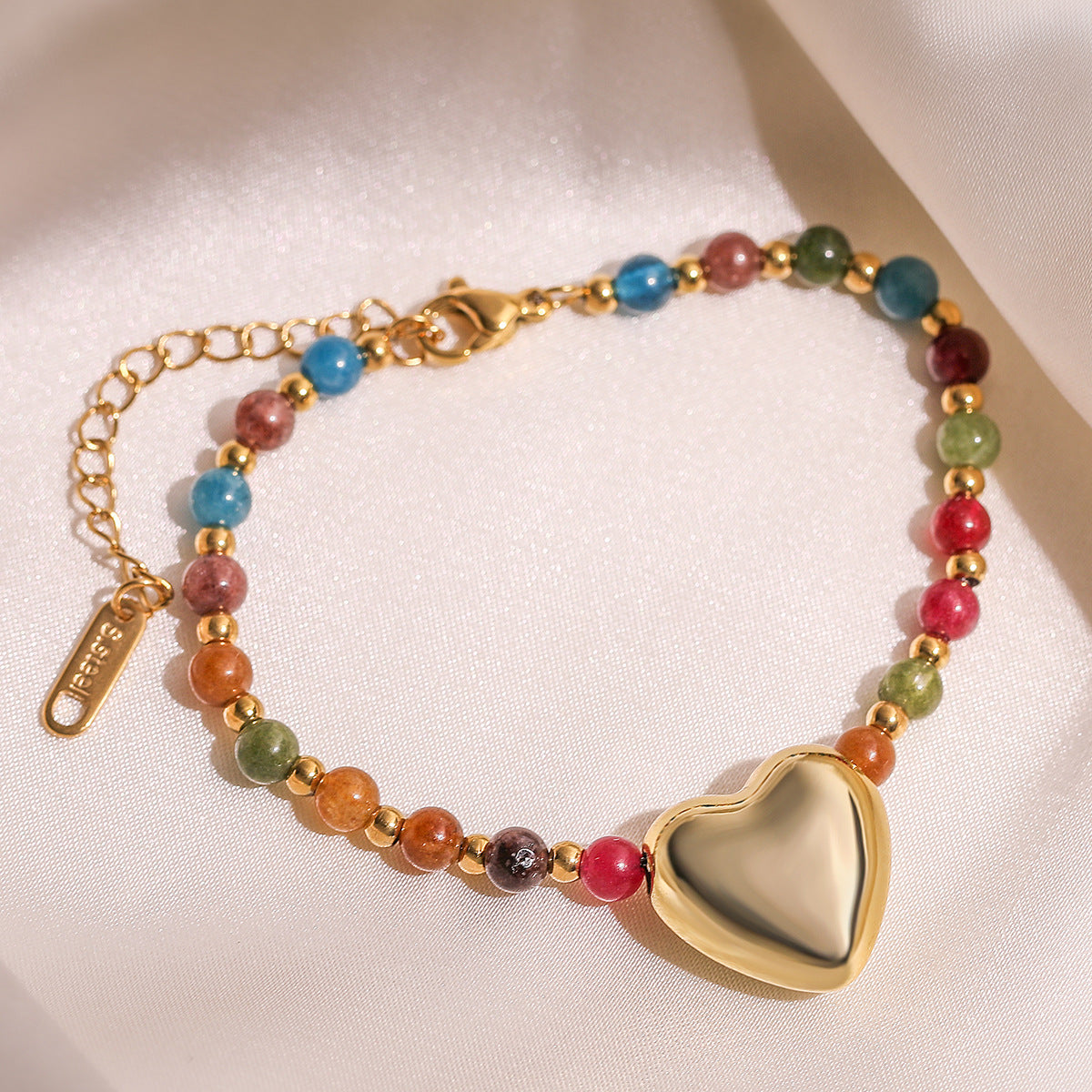 Bracciale da donna in acciaio inossidabile a forma di cuore con perline e finitura placcata, con dettagli in cristallo irregolare