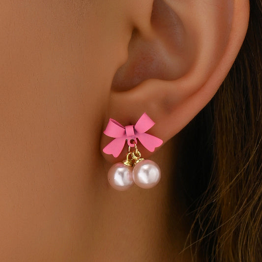 Orecchini a perno da donna in lega a forma di fiocco minimalisti con intarsio di perle, gioielli per lobi dolci e freschi rosa