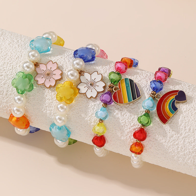 Bracciale per Bambine con Ciondolo a Cuore Floreale e Arcobaleno in Resina Plastica con Perline e Stella