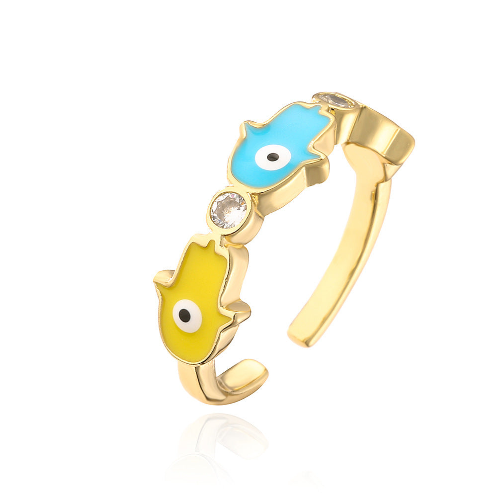Anello da donna in rame con placca in oro 18K, finitura smaltata e intarsio in zircone, design Mano di Fatima